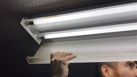 How to remove fluorescent light cover with clips - Remove the Bulbs and Fluorescent Light Fixture Cover. Unplug the fixture or turn off the power at the main panel. Remove the fluorescent ballast compartment cover to expose the internal wiring and ballast. Note: The attachment method for ballast covers varies widely among manufacturers. It may be attached with nuts or clips or simply snapped ...